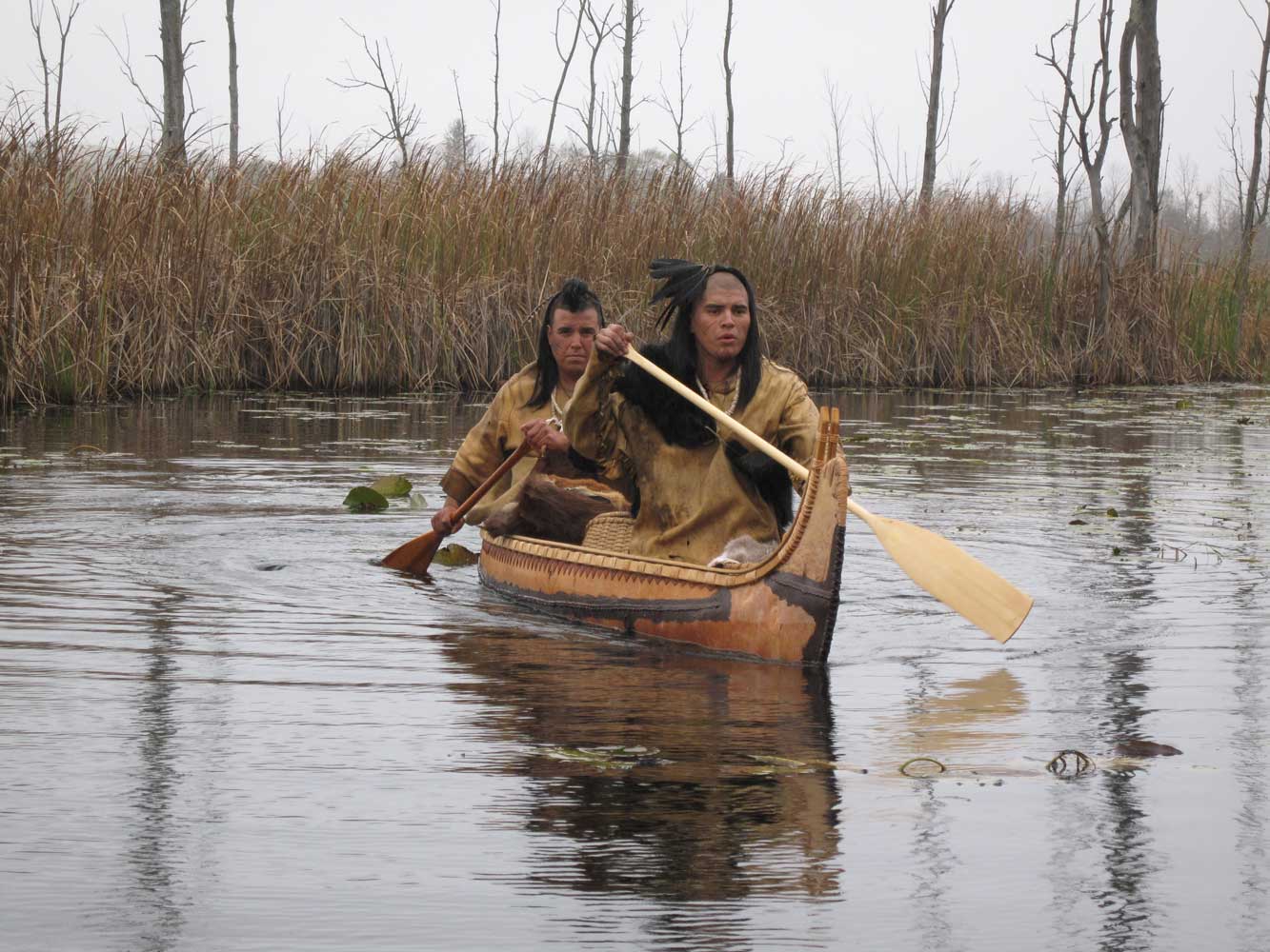 In this scene, we're showing the "axe" traversing great distances. The birchbark canoe is authentic.